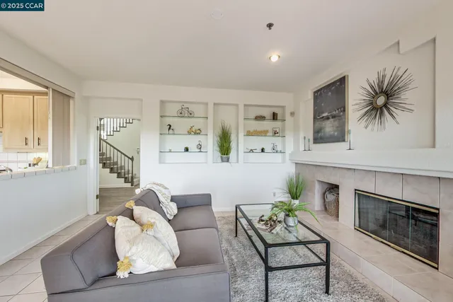 a living room with furniture and large windows