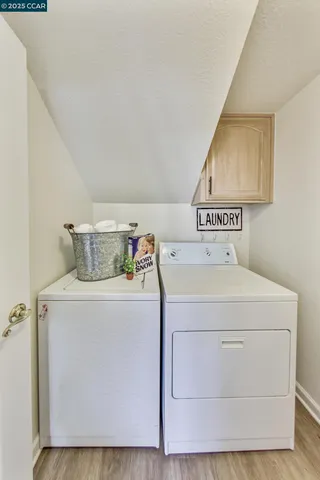 a spacious bedroom with a bed and a flat screen tv