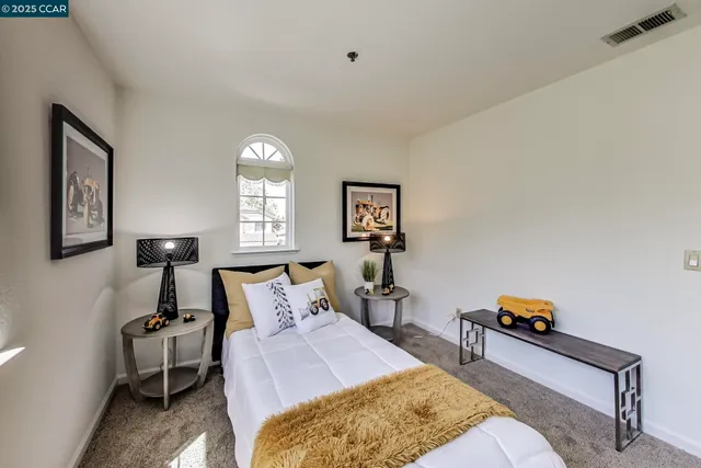 a living room with furniture and a lamp