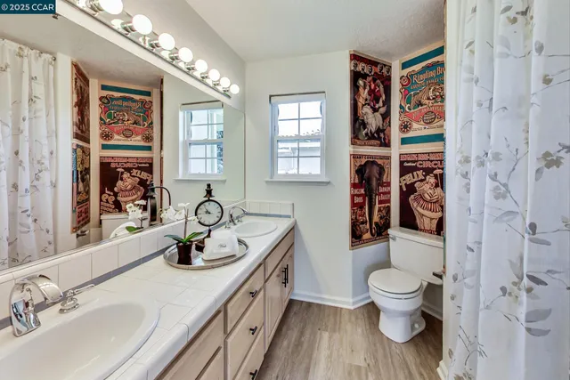 a view of house with a yard and sitting area