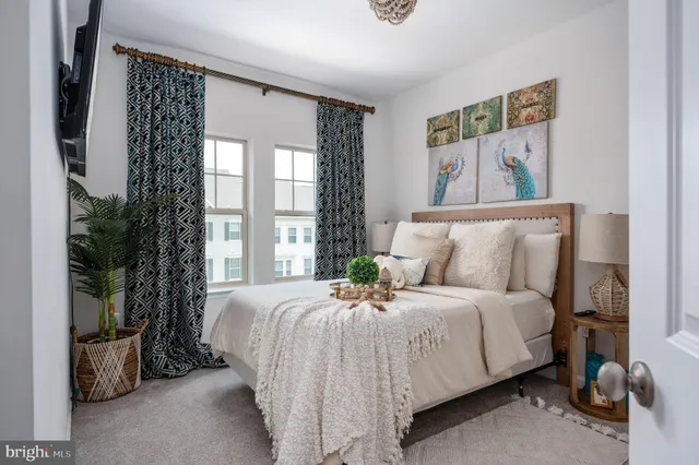 a bedroom with bed and a window