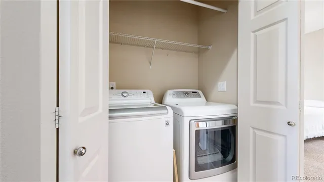 an aerial view of a house with swimming pool and outdoor seating