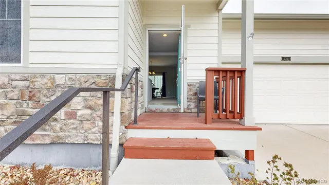 an aerial view of a house with a garden and lake view
