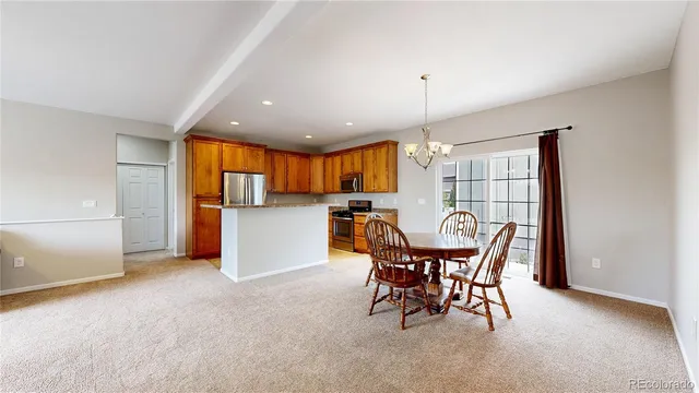 a kitchen with granite countertop a sink and a stove top oven