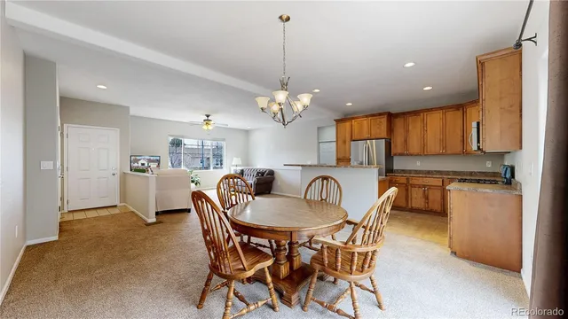 a spacious bedroom with a bed and a dresser