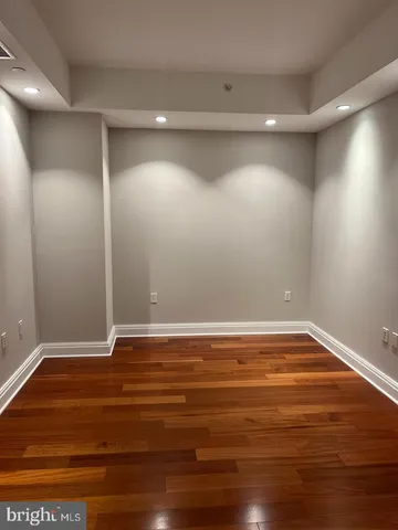 a view of room with wooden floor