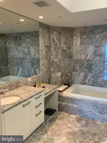 a sign that is sitting in front of flowers