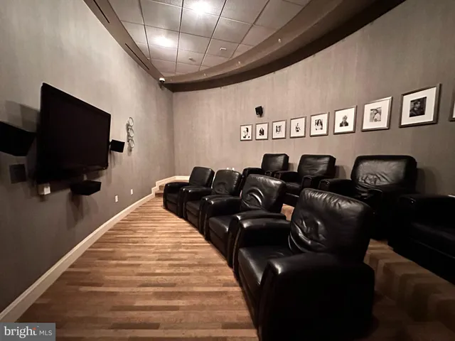 a view of a living room and chandelier fan kitchen view