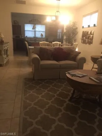 a lobby with furniture and a potted plant