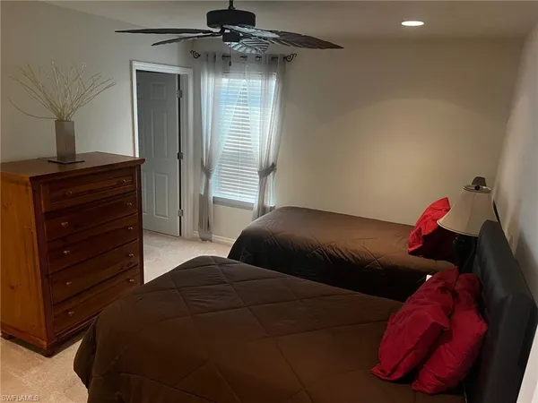 a bedroom with a bed and a closet