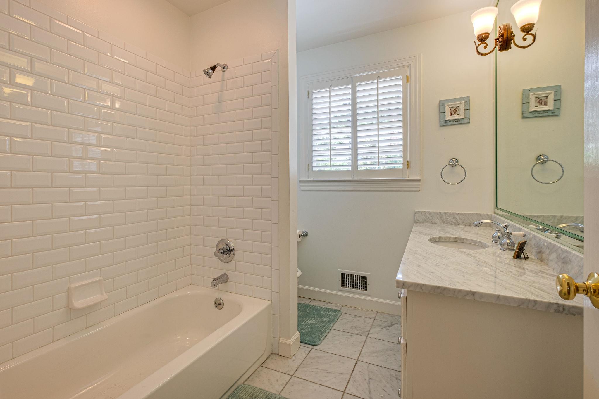 129 Cheek Road Nashville, TN 37205 - Photo 16 of 30 a bathroom with a tub sink and mirror