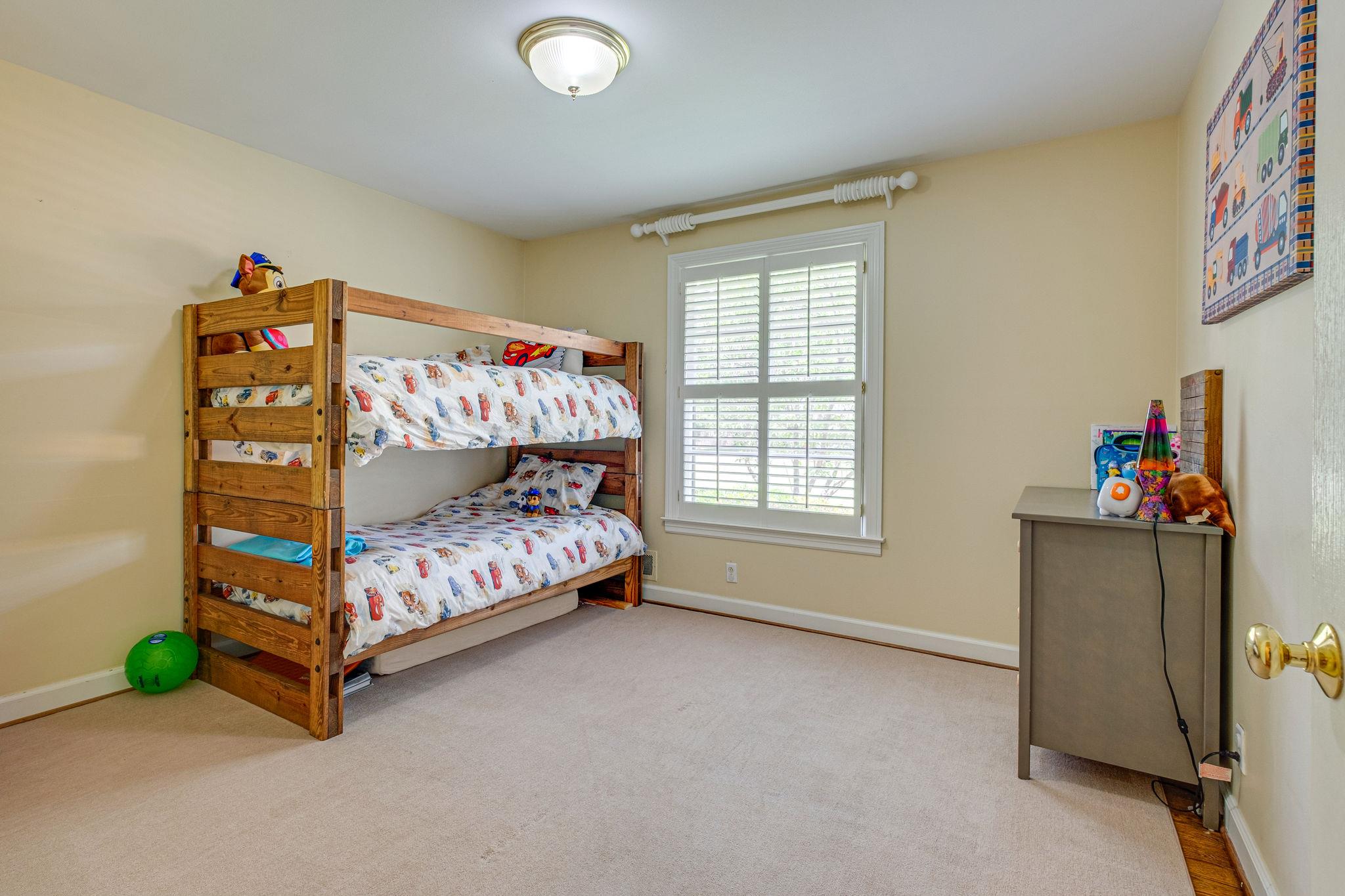 129 Cheek Road Nashville, TN 37205 - Photo 17 of 30 a bedroom with a bed and a window