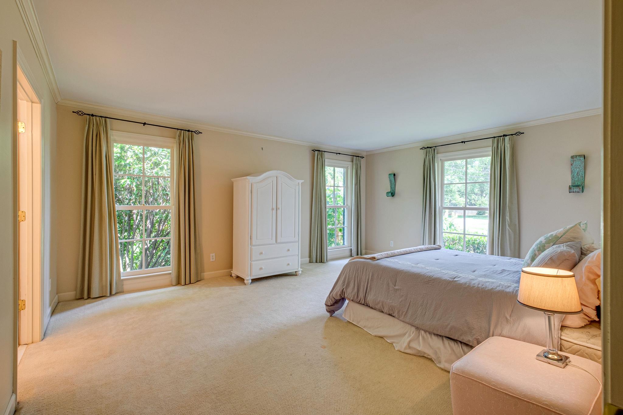 129 Cheek Road Nashville, TN 37205 - Photo 18 of 30 a bedroom with a bed and large window