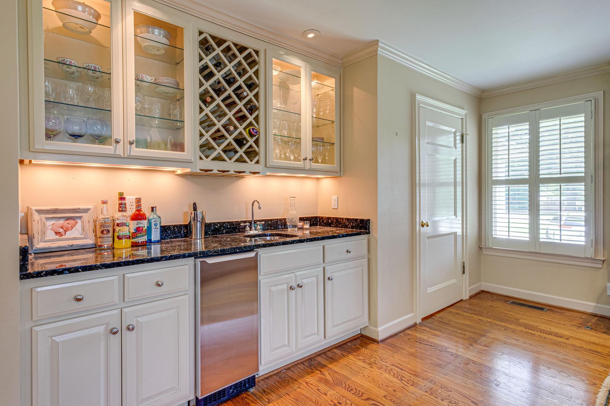 129 Cheek Road Nashville, TN 37205 - Photo 26 of 30 a kitchen with granite countertop stainless steel appliances a sink and a window