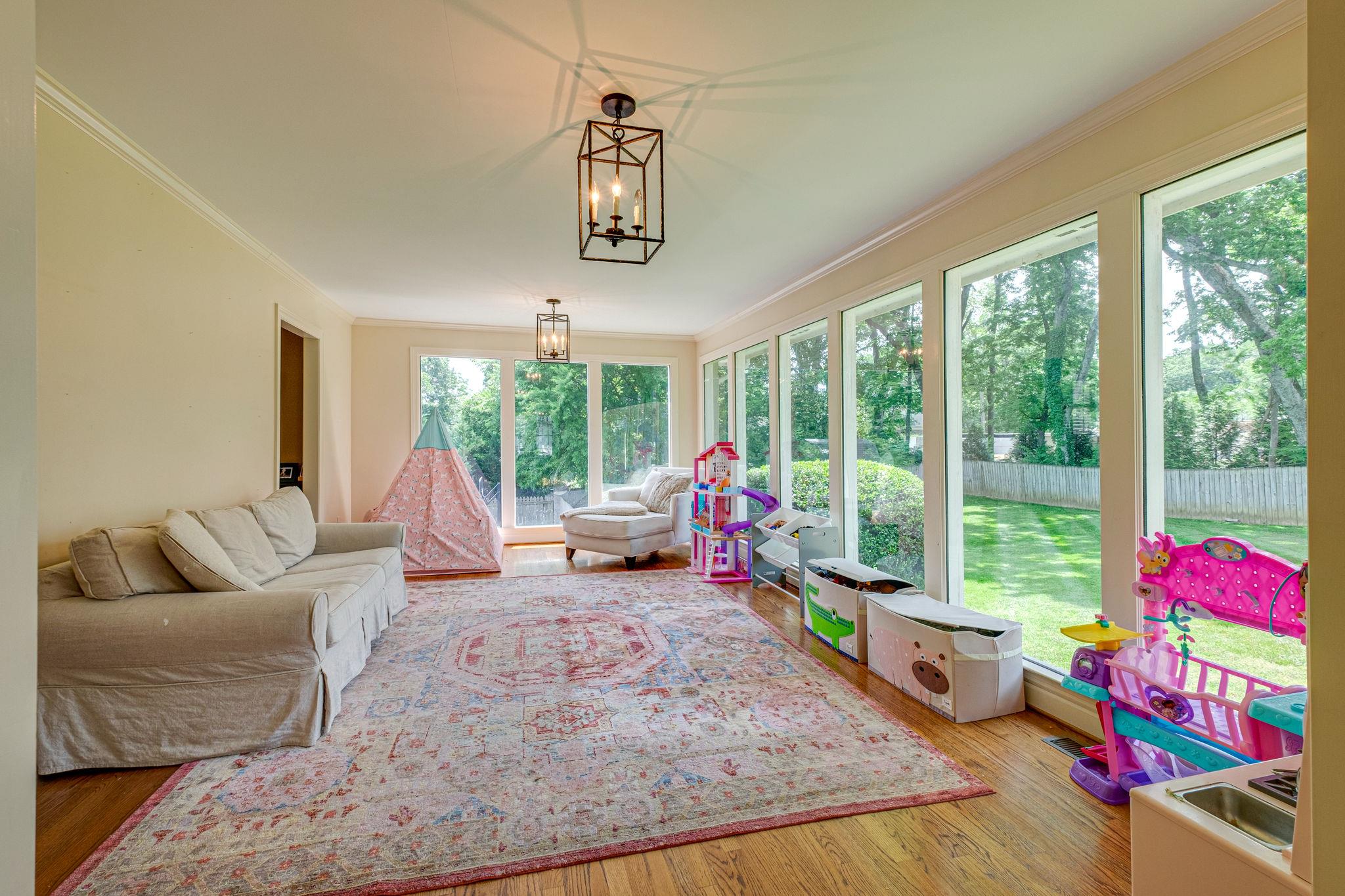 129 Cheek Road Nashville, TN 37205 - Photo 27 of 30 a living room with furniture and a floor to ceiling window