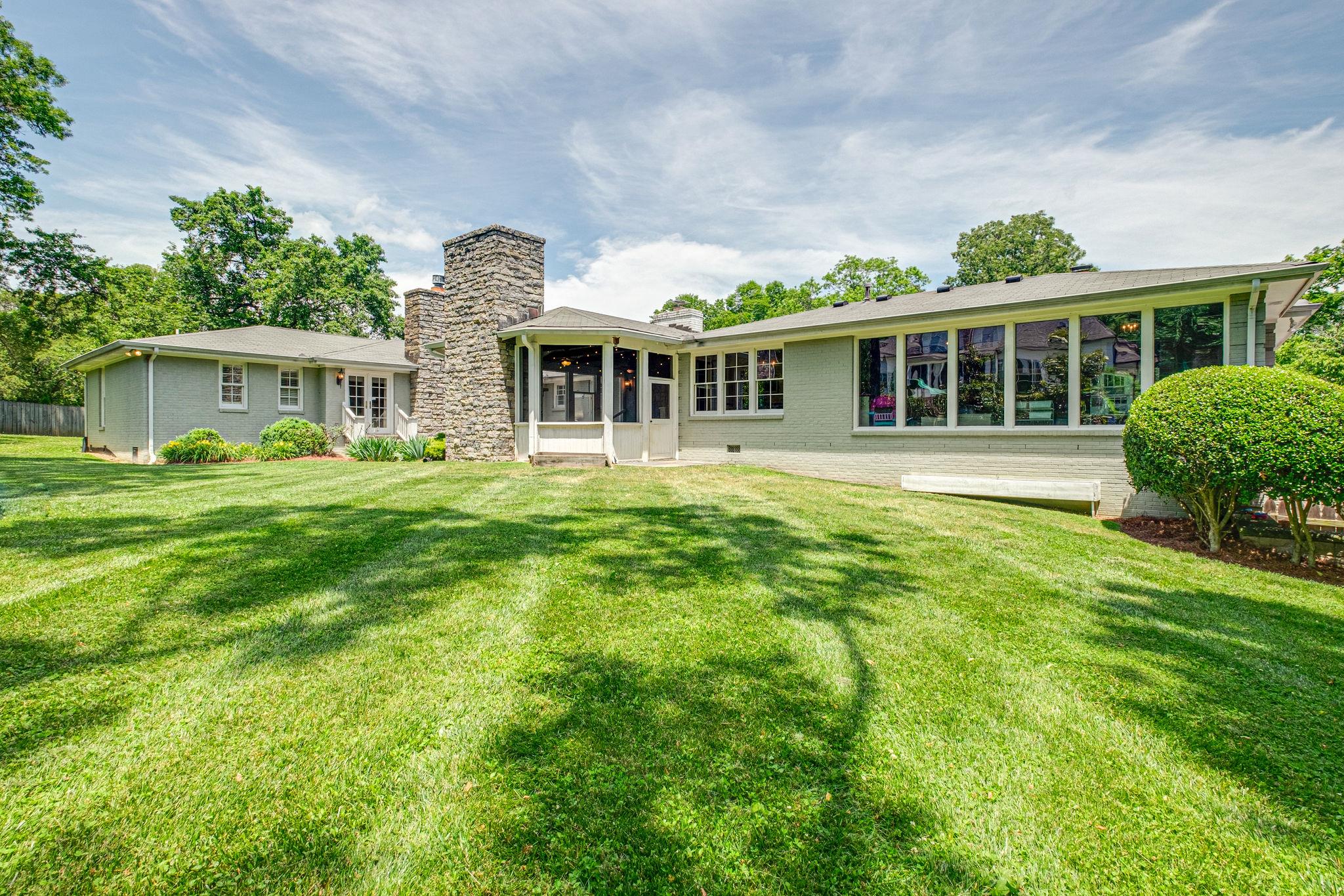 129 Cheek Road Nashville, TN 37205 - Photo 30 of 30 a front view of a house with a garden