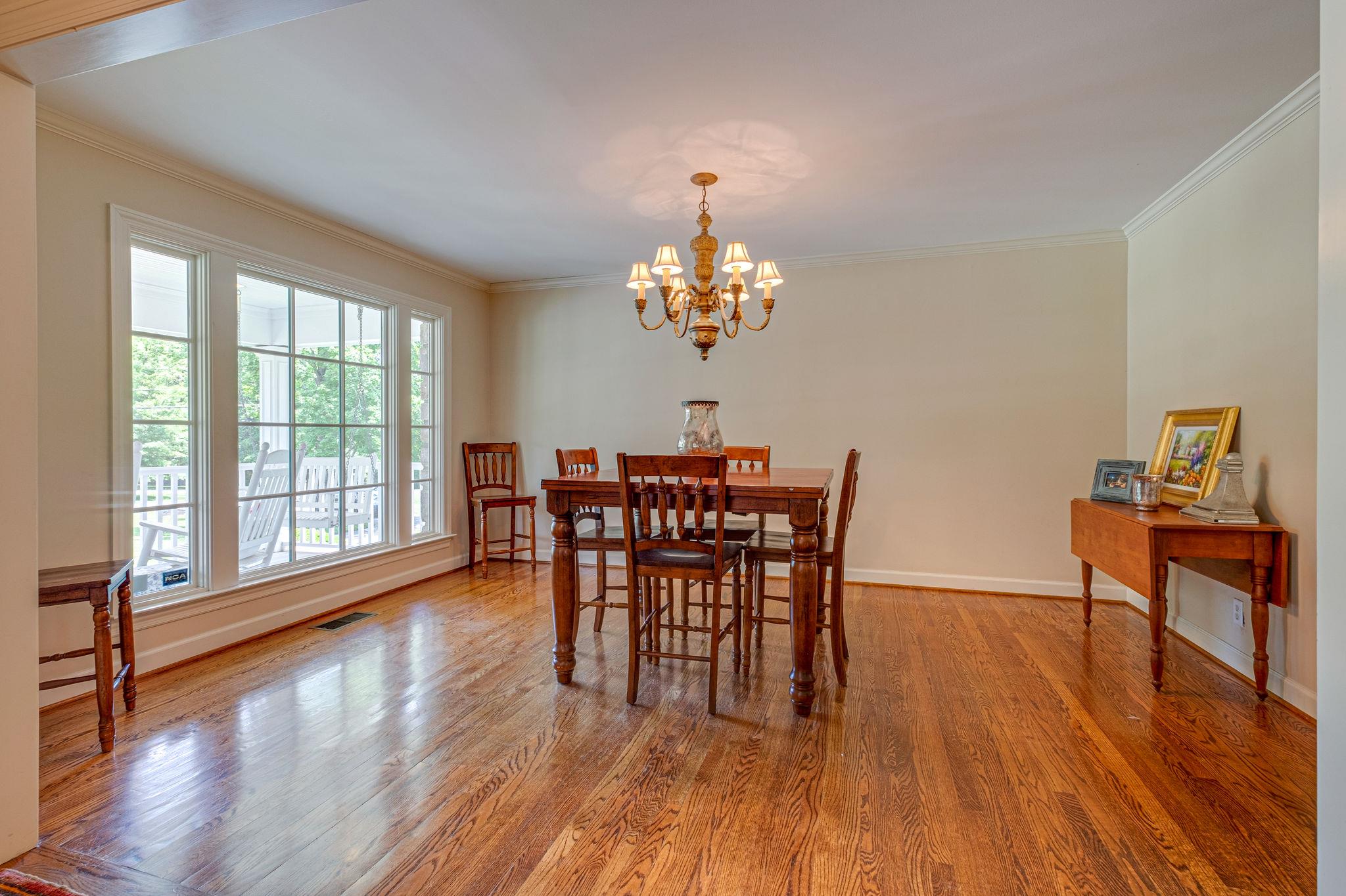 129 Cheek Road Nashville, TN 37205 - Photo 6 of 30 a dining room with furniture a chandelier and wooden floor