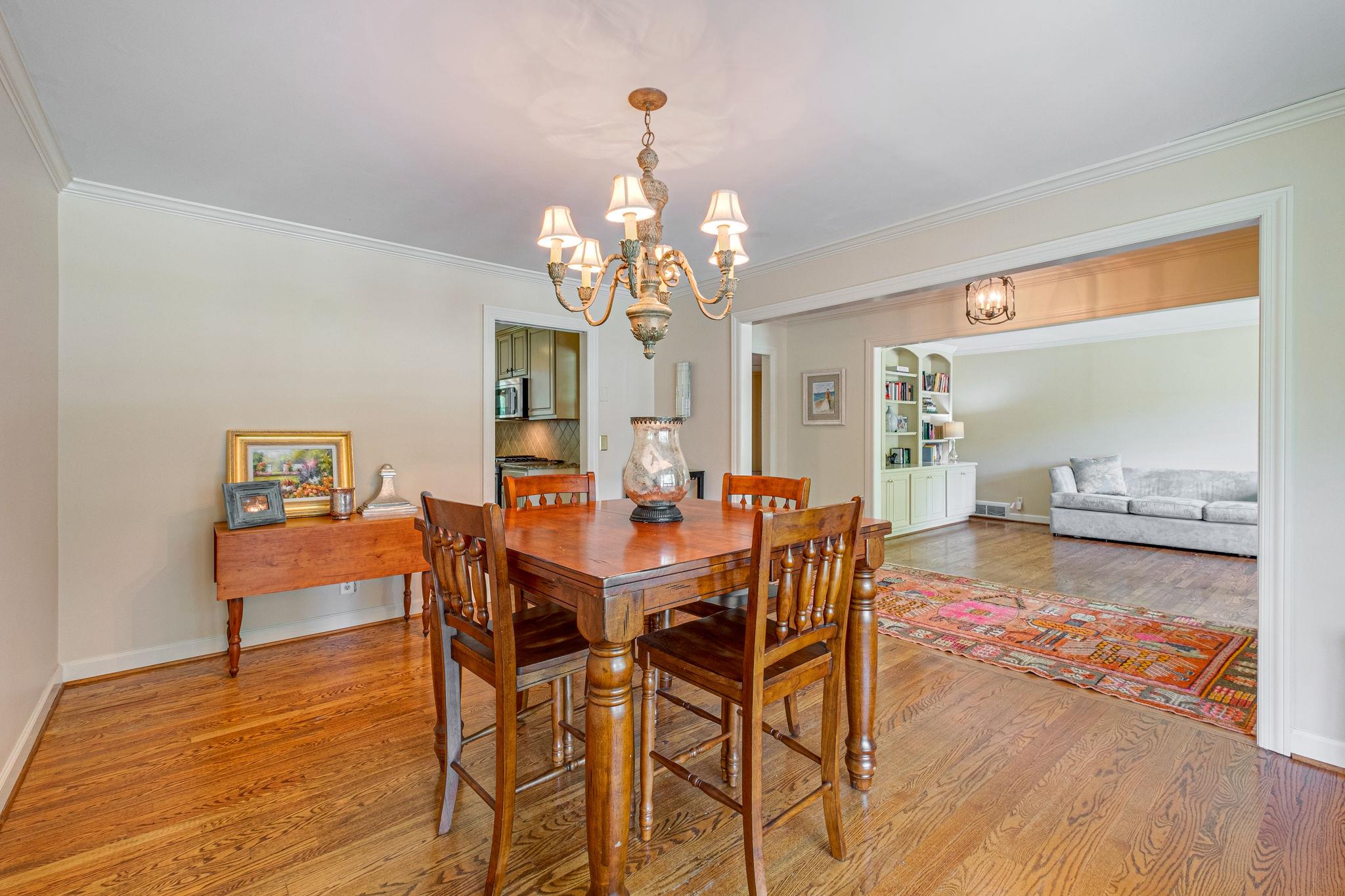129 Cheek Road Nashville, TN 37205 - Photo 7 of 30 a view of a dining room with furniture a chandelier and wooden floor