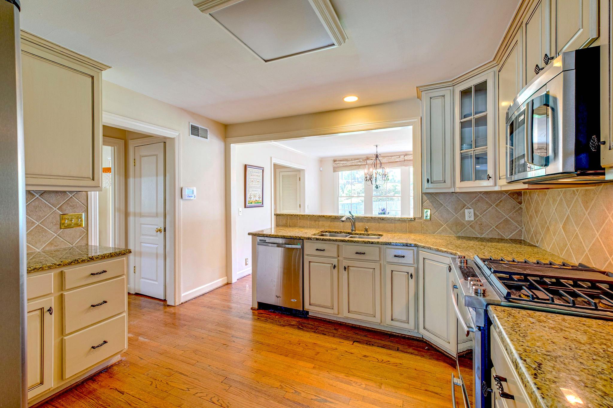 129 Cheek Road Nashville, TN 37205 - Photo 8 of 30 a kitchen with stainless steel appliances granite countertop a stove and a sink