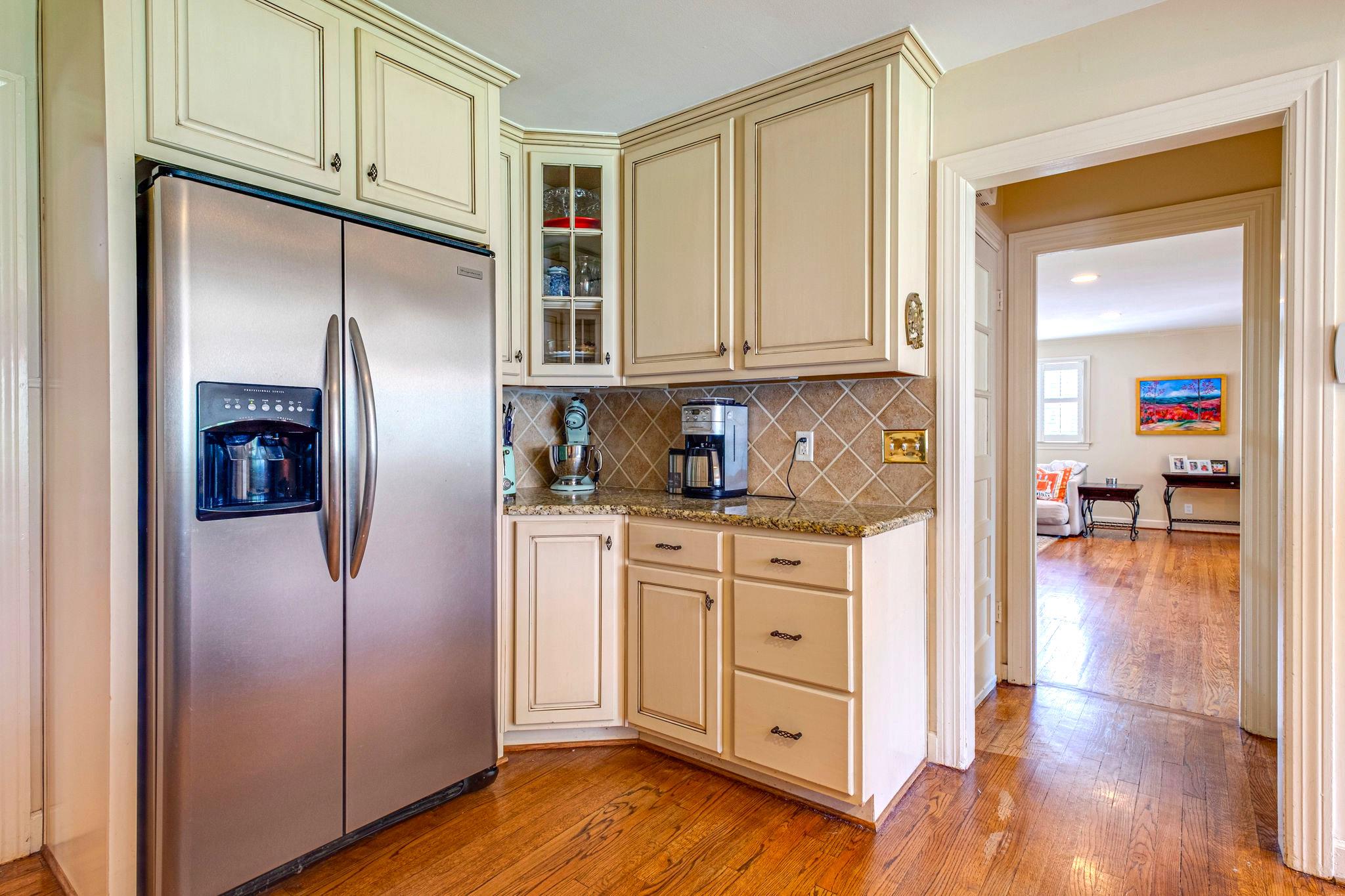 129 Cheek Road Nashville, TN 37205 - Photo 9 of 30 a kitchen with stainless steel appliances granite countertop a refrigerator and a stove top oven