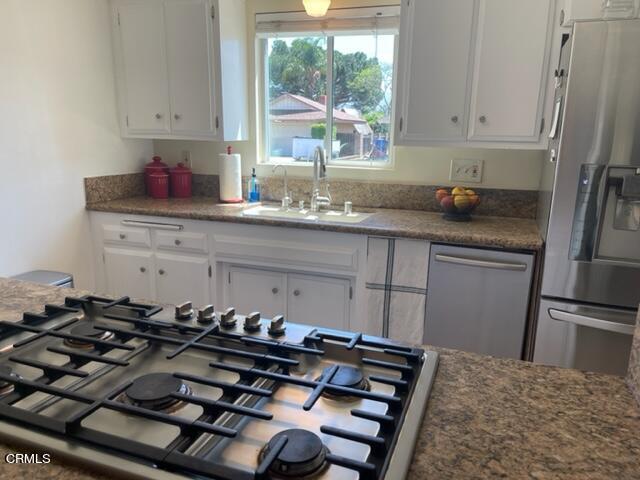 1215 Maple Street Santa Paula, CA 93060 - Photo 12 of 15 a kitchen with a stove and a window