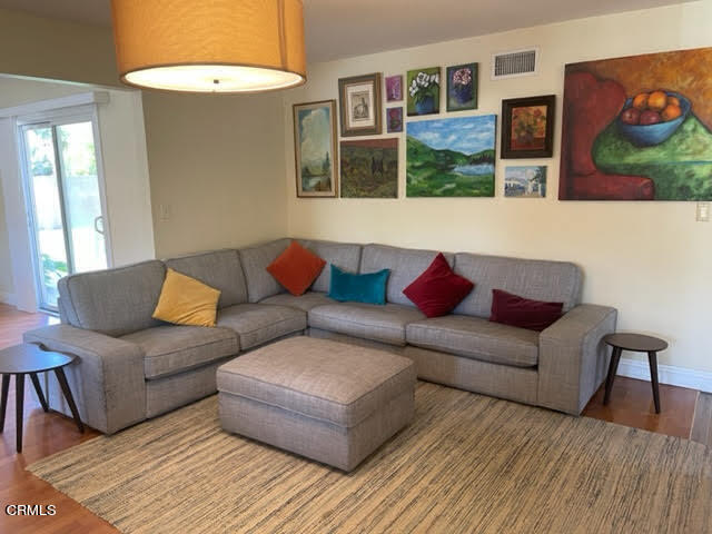 1215 Maple Street Santa Paula, CA 93060 - Photo 3 of 15 a living room with furniture and painting on the wall