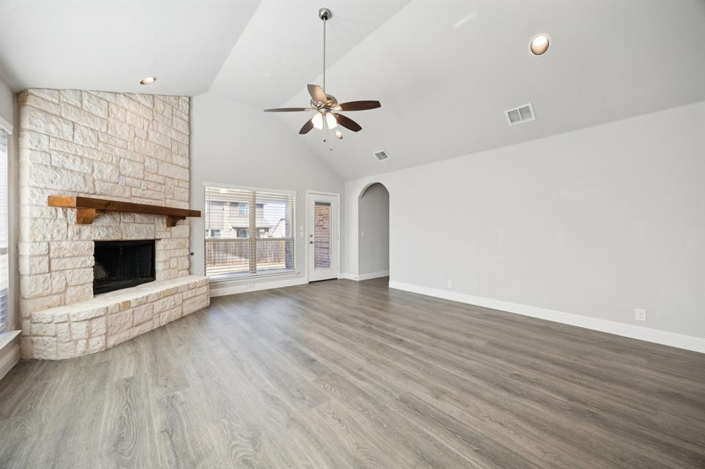 1036 Sandy Hill Burleson, TX 76028 - Photo 17 of 37 a view of an empty room with a fireplace and a window