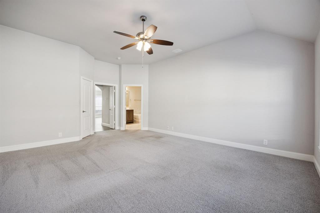 1036 Sandy Hill Burleson, TX 76028 - Photo 21 of 37 an empty room with chandelier fan and windows