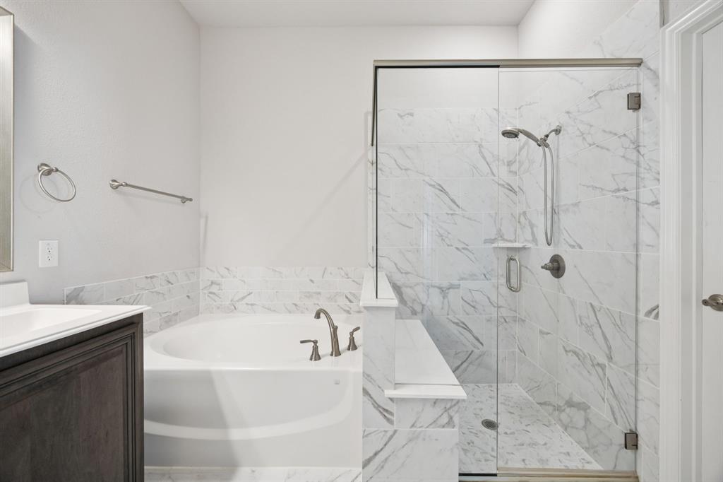 1036 Sandy Hill Burleson, TX 76028 - Photo 25 of 37 a bathroom with a bathtub and shower