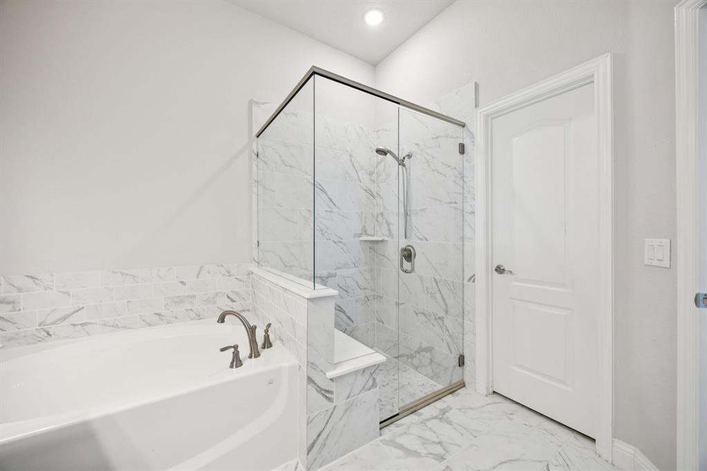 1036 Sandy Hill Burleson, TX 76028 - Photo 26 of 37 a bathroom with a bathtub and shower