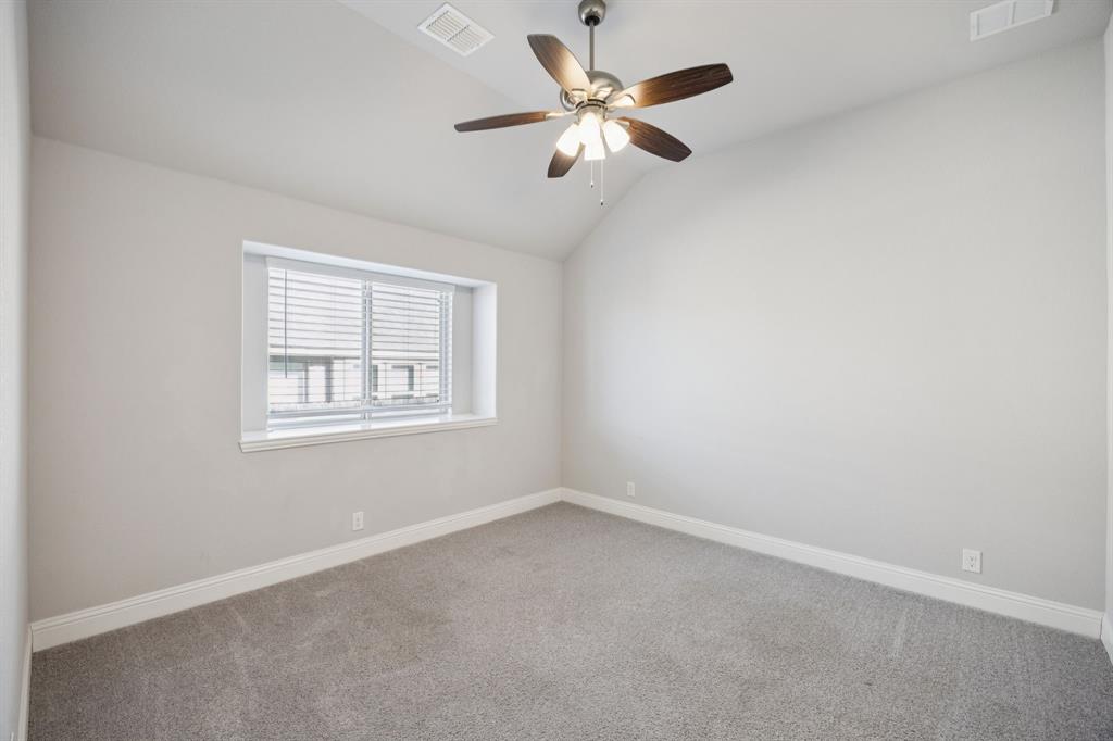 1036 Sandy Hill Burleson, TX 76028 - Photo 29 of 37 an empty room with a window and a fan
