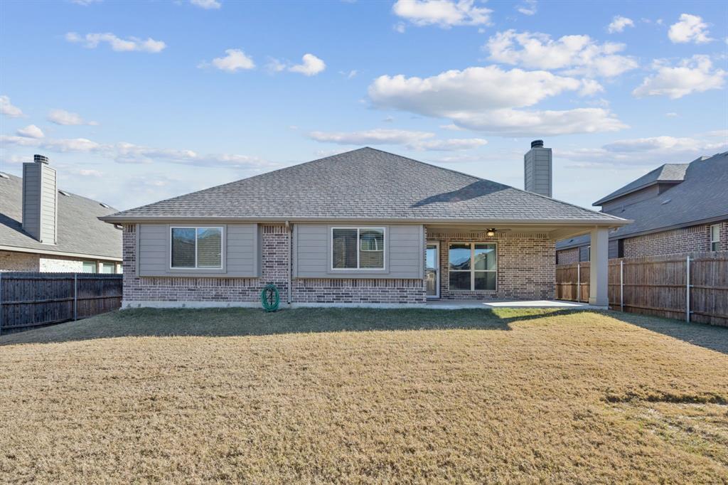 1036 Sandy Hill Burleson, TX 76028 - Photo 34 of 37 a front view of a house with a yard