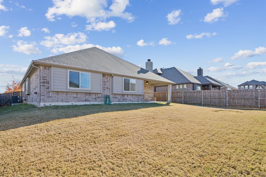 1036 Sandy Hill Burleson, TX 76028 - Photo 35 of 37 a front view of a house with a yard