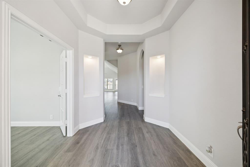 1036 Sandy Hill Burleson, TX 76028 - Photo 4 of 37 a view of a hallway with wooden floor