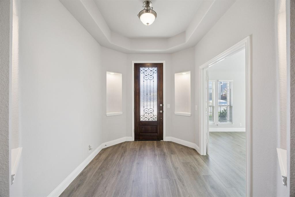 1036 Sandy Hill Burleson, TX 76028 - Photo 5 of 37 wooden floor in an empty room with a window