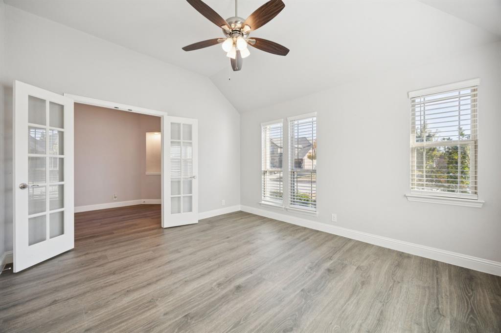 1036 Sandy Hill Burleson, TX 76028 - Photo 6 of 37 a view of an empty room with a window and wooden floor
