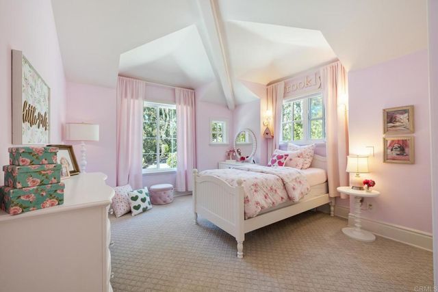 a bedroom with a bed and a table