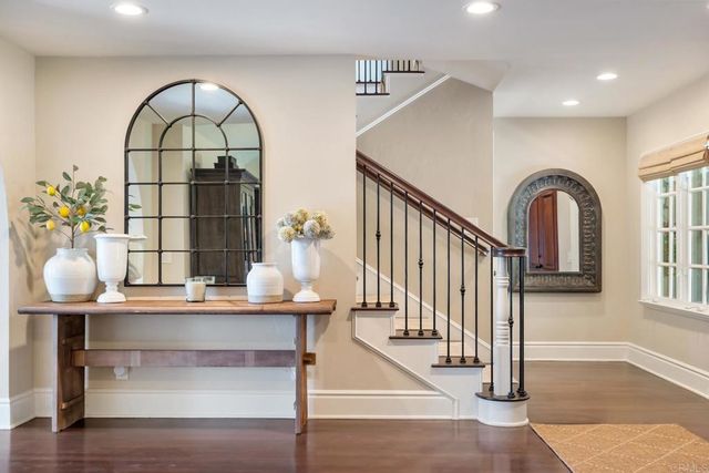 a view of hall way with furniture and entryway