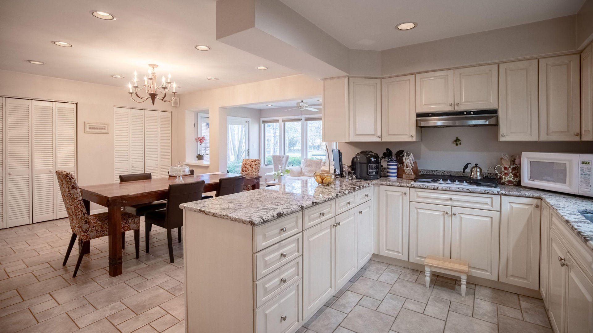 1800 Clover Road Northbrook, IL 60062 - Photo 15 of 71 a kitchen with cabinets appliances and a dining table
