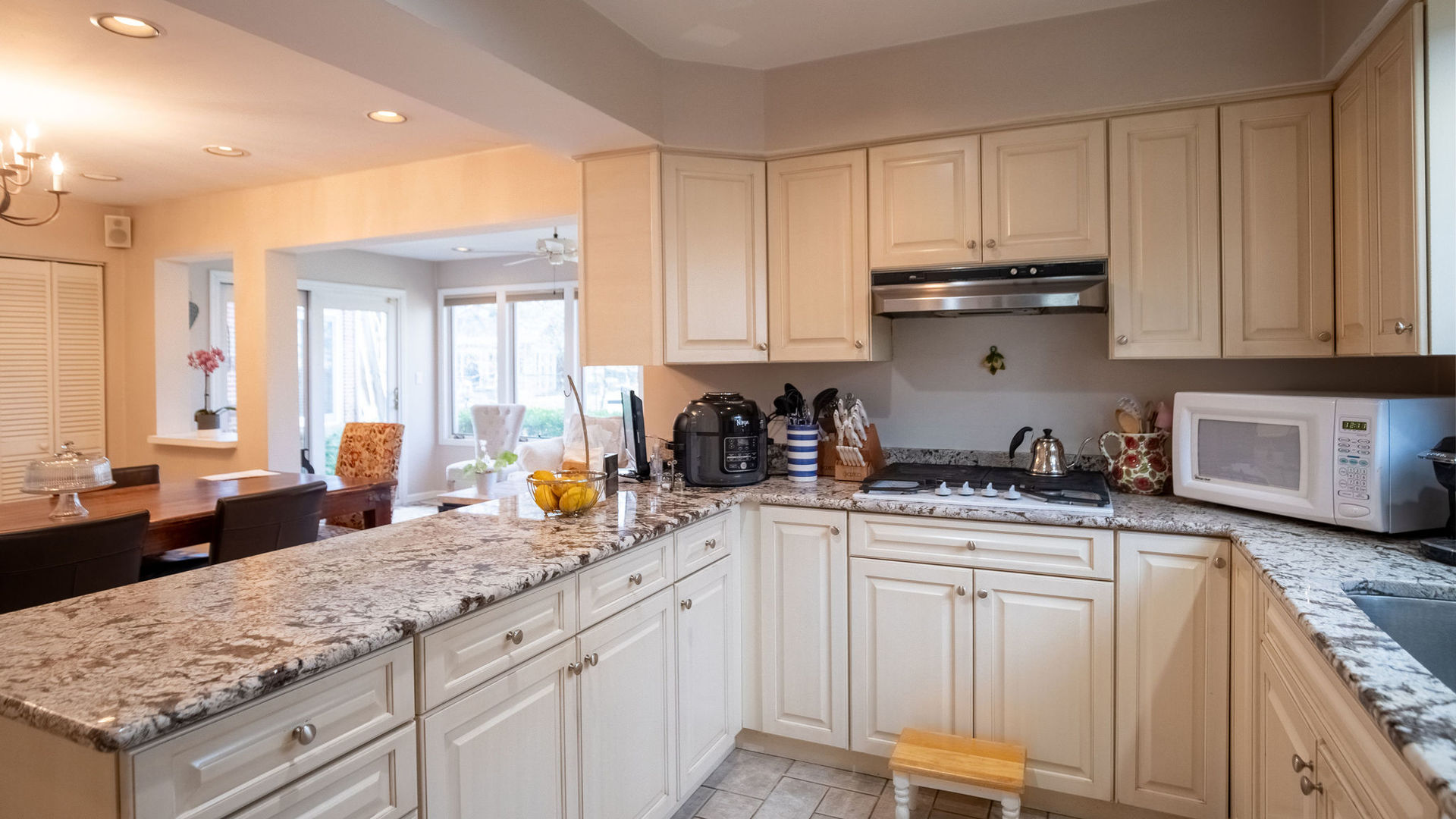 1800 Clover Road Northbrook, IL 60062 - Photo 16 of 71 a kitchen with stainless steel appliances granite countertop a sink stove and cabinets