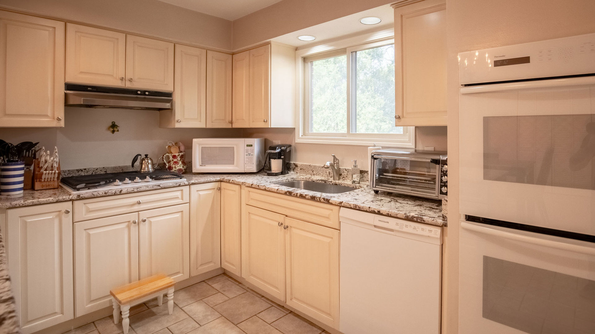 1800 Clover Road Northbrook, IL 60062 - Photo 19 of 71 a kitchen with white cabinets and white appliances