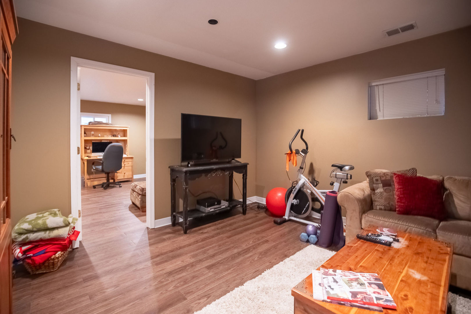 1800 Clover Road Northbrook, IL 60062 - Photo 40 of 71 a living room with furniture a flat screen tv and a gym