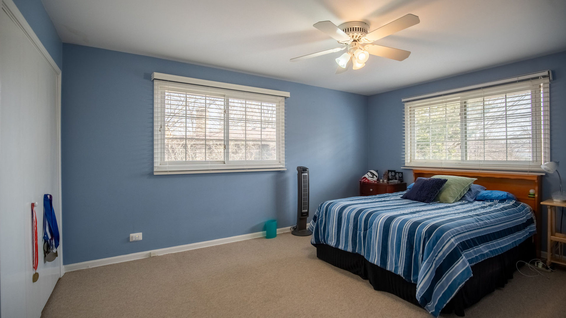 1800 Clover Road Northbrook, IL 60062 - Photo 45 of 71 a bedroom with a bed and a ceiling fan next to a window