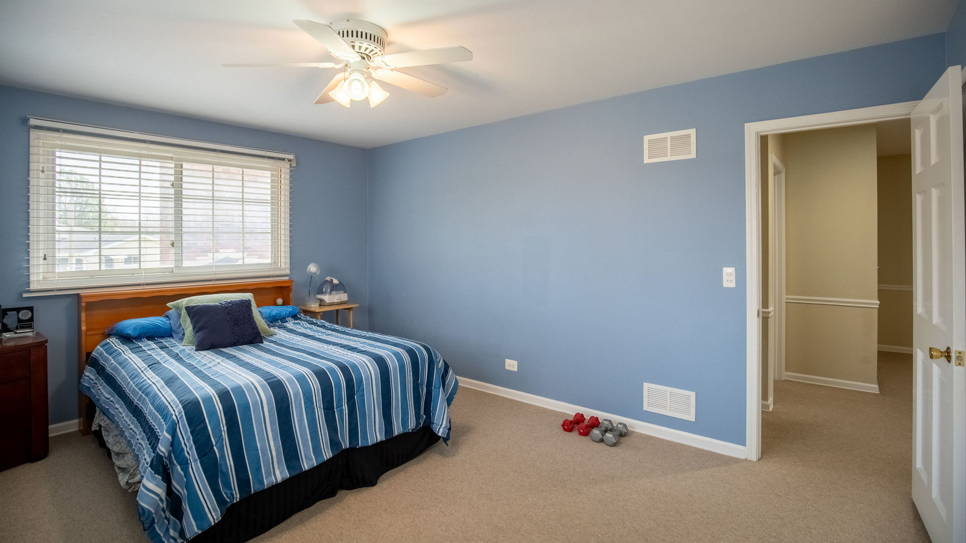 1800 Clover Road Northbrook, IL 60062 - Photo 47 of 71 a bedroom with a bed and a chandelier fan