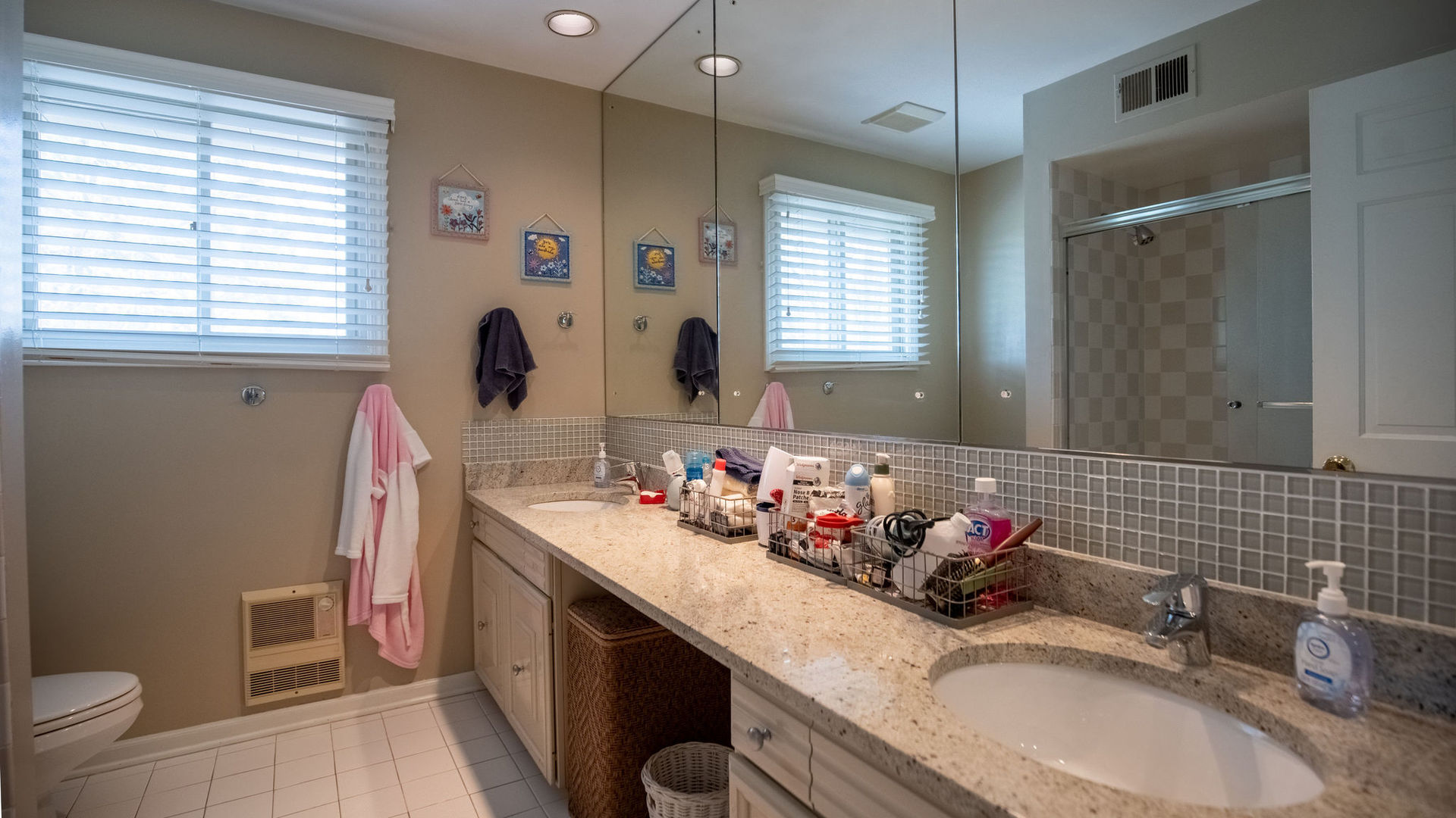 1800 Clover Road Northbrook, IL 60062 - Photo 53 of 71 a bathroom with a granite countertop sink a toilet and a mirror