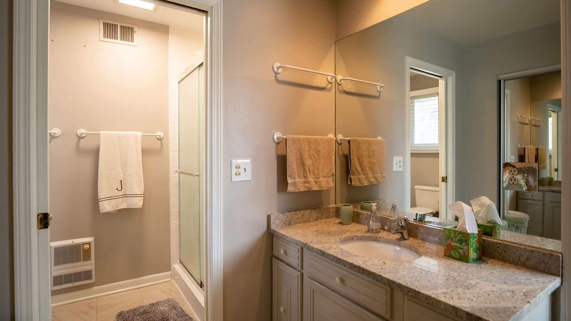 1800 Clover Road Northbrook, IL 60062 - Photo 59 of 71 a bathroom with a granite countertop sink shower and a mirror