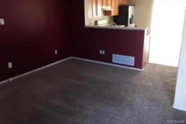 a view of a room that has a window