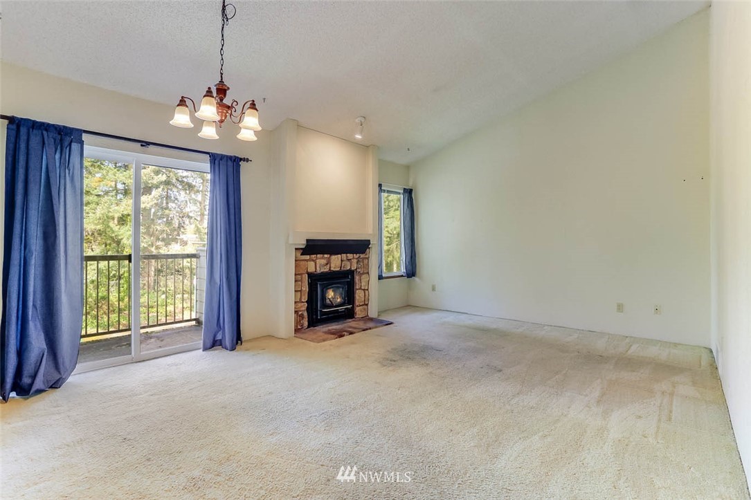14401 Southeast Petrovitsky Road, Unit F203 Renton, WA 98058 - Photo 1 of 16 a view of an empty room with a window