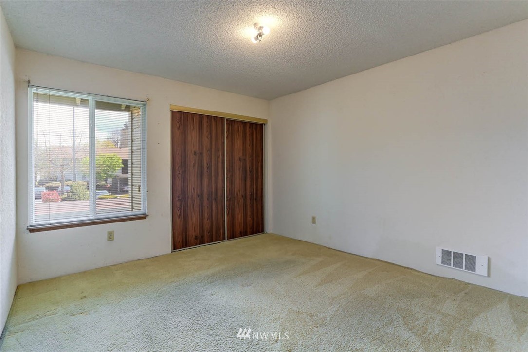 14401 Southeast Petrovitsky Road, Unit F203 Renton, WA 98058 - Photo 11 of 16 an empty room with windows