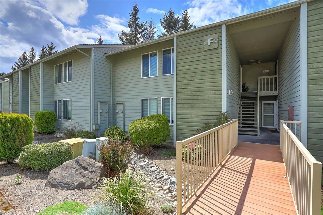 14401 Southeast Petrovitsky Road, Unit F203 Renton, WA 98058 - Photo 15 of 16 a view of a house with a yard